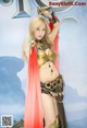 A woman dressed in a costume holding a sword.